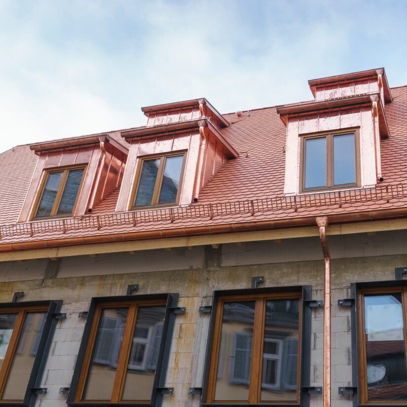 A House With A Copper Roofing Tiles