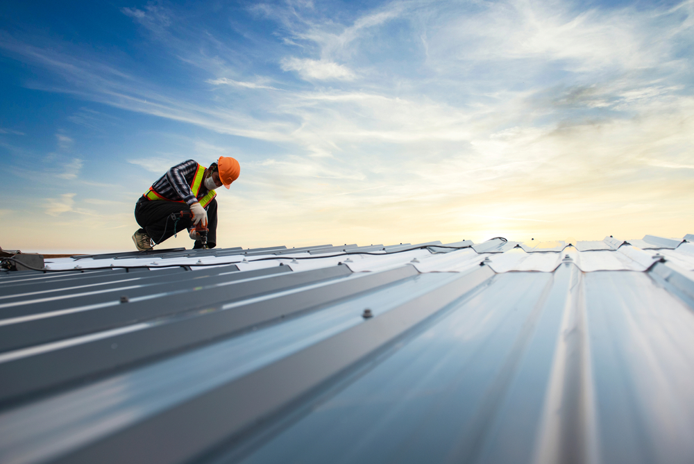 Photo of a Man Installing Roof